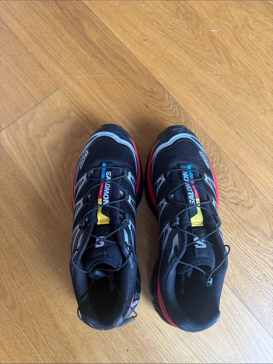 Salomon Shoes - Salomon Black Sneakers with Red and Yellow Accents